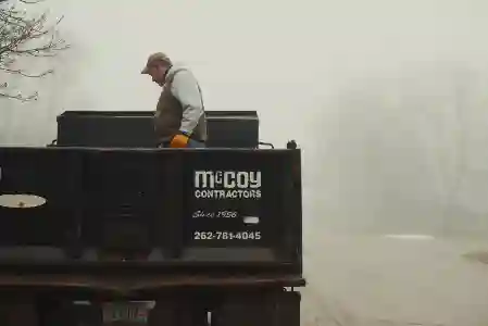 McCoy Contractors foundation repair team inside company truck Milwaukee