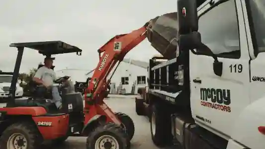 McCoy Contractors foreman loading truck for foundation repair services Milwaukee