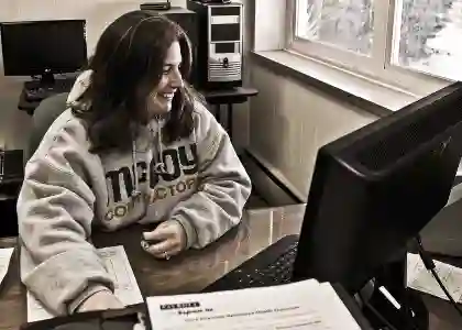 Becky working in McCoy Contractors office - foundation repair company staff Brookfield Wisconsin