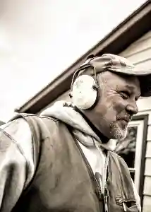 Happy McCoy Contractors foundation repair crew with earmuffs and safety equipment Milwaukee