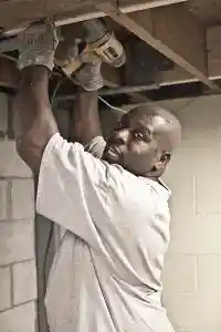 McCoy Contractors foundation repair contractor drilling in basement Milwaukee