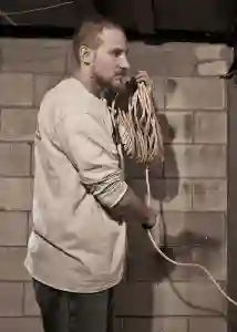 McCoy Contractors foundation repair crew wrapping rope in basement Milwaukee