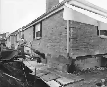 Bowed basement wall structural repair by McCoy Contractors - basement wall bowing repair